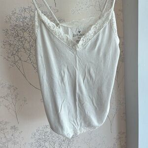 White ribbed v-neck tank top with lace trim